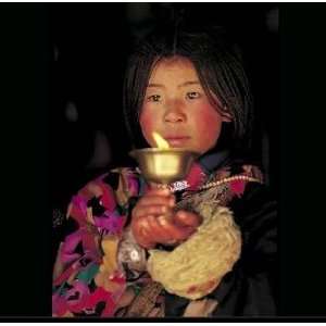  Young Girl with a Candle At the Jokhang Temple in Lhasa 