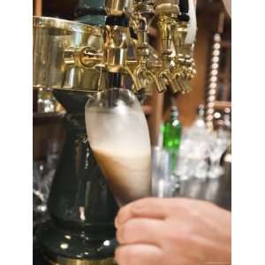 Bartender Pours a Beer from the Tap in Jimmys Pub in Ojai, California 