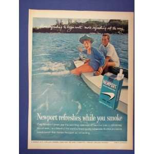 Newport Cigarettes,man/woman/boat/with womans feet in water. 60s 